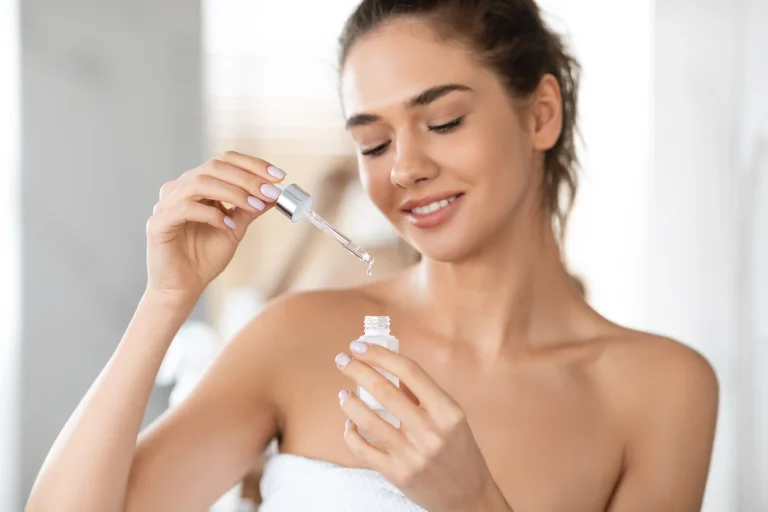 Attractive_Lady_Applying_Facial_Serum